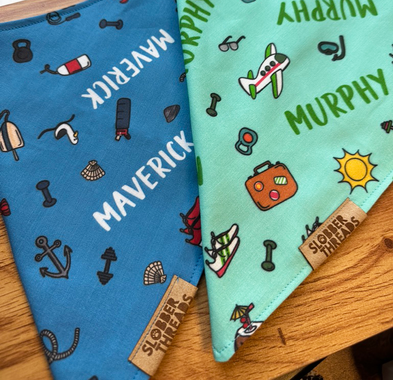 Blue bandanas with designs and dog names on them