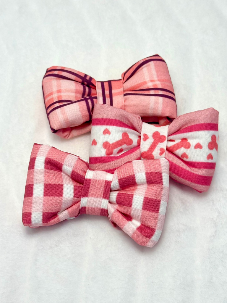 pink bowties on a white background